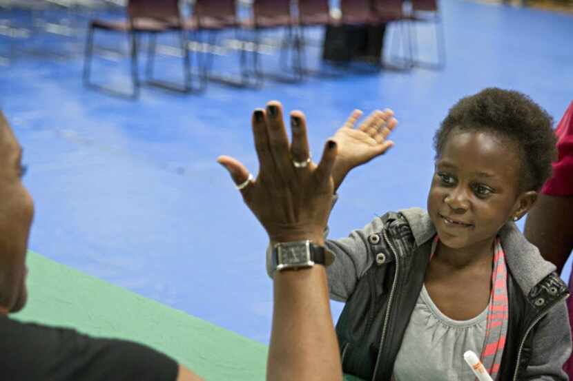 High fives at the Harambee Festival  at the Martin Luther King Community Center in Dallas