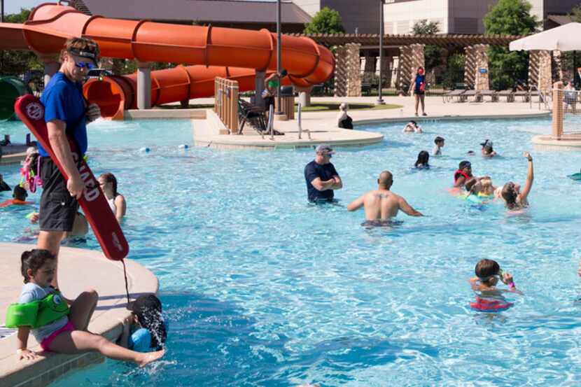 Hotel guests play in the outdoor water park section at the Great Wolf Lodge.
