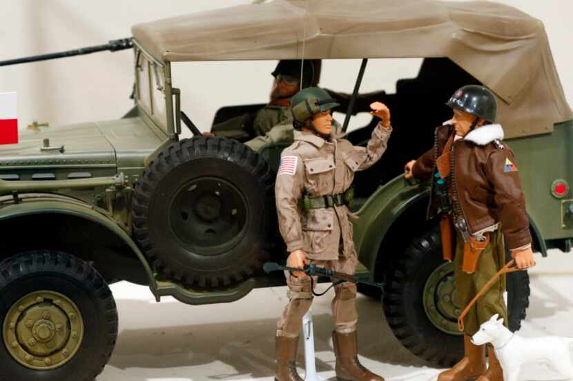 A Gen. George Patton G.I. Joe action figure, right, and other G.I. Joes