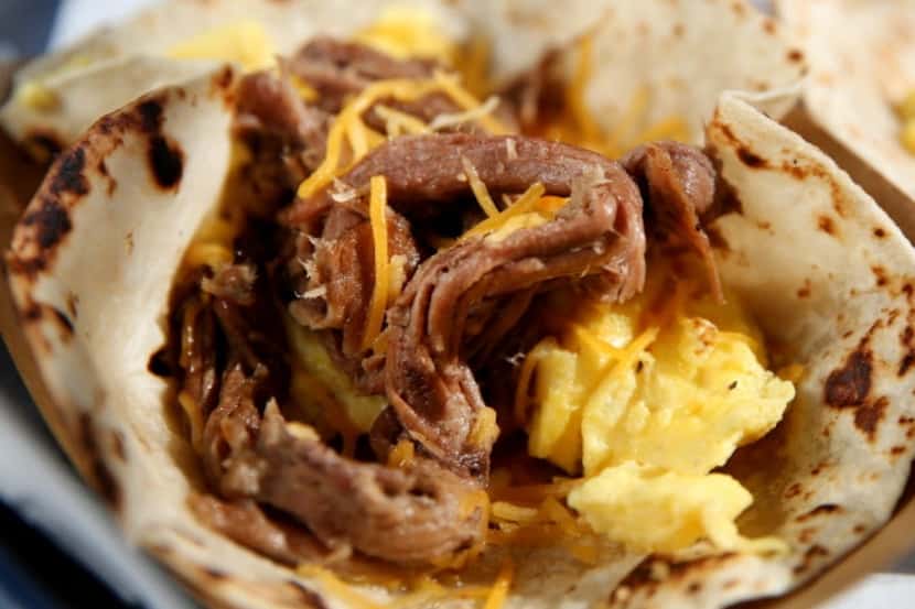 The brisket, egg and cheese taco served at Rusty Taco.