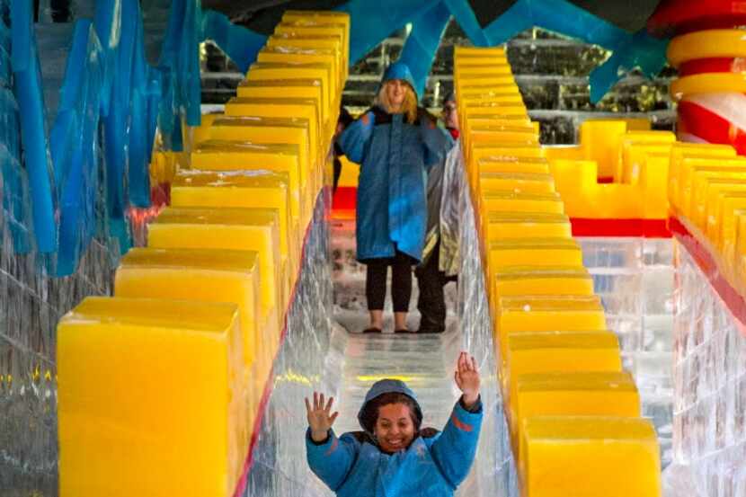 Carla Lule tries out a slide at ICE!, the annual holiday attraction at the Gaylord Texan hotel.