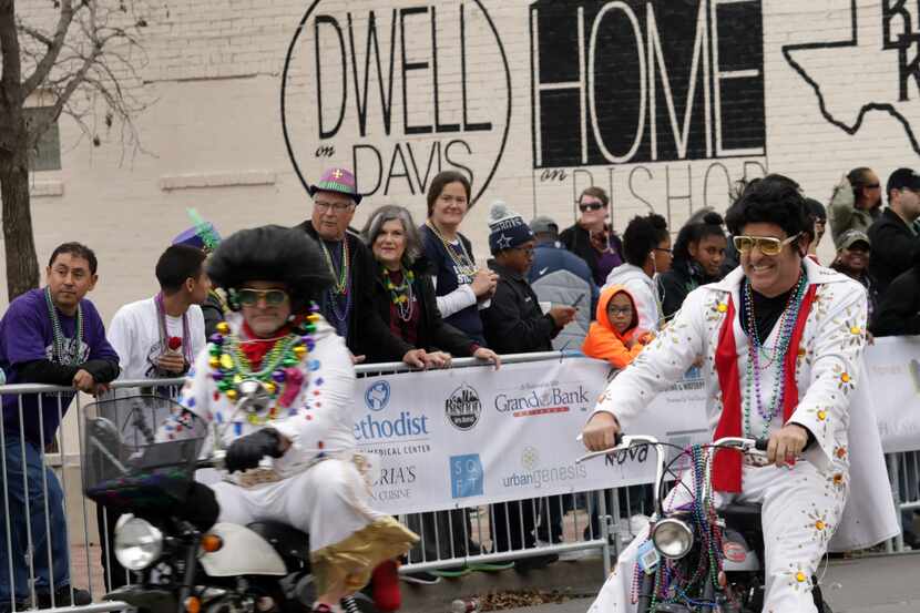 Elvises ride in the Oak Cliff Mardi Gras parade in the Bishop Arts District.