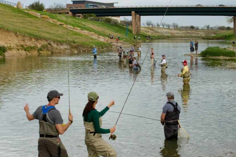 Attendees at Flyfest in Fort Worth try their hand at fly fishing in the Trinity River.