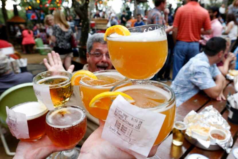Beer is carried to a table at the Katy Trail Ice House Outpost in Plano. 