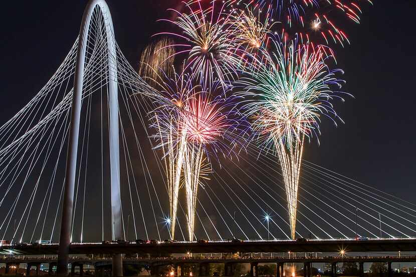 Fireworks explode over the Margaret Hunt Hill Bridge during the Red, White, and Boom on the...