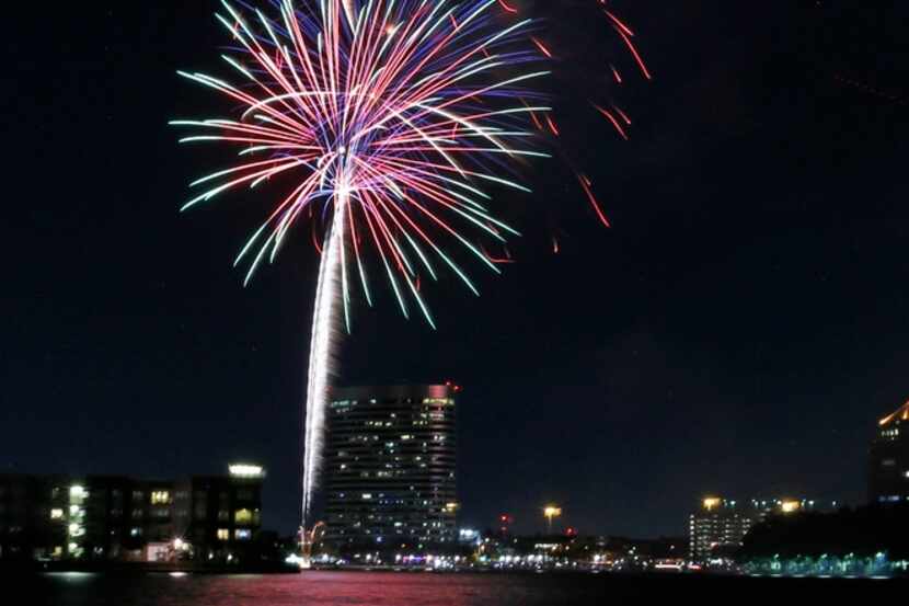 Fireworks light up over Lake Carolyn in Las Colinas. 