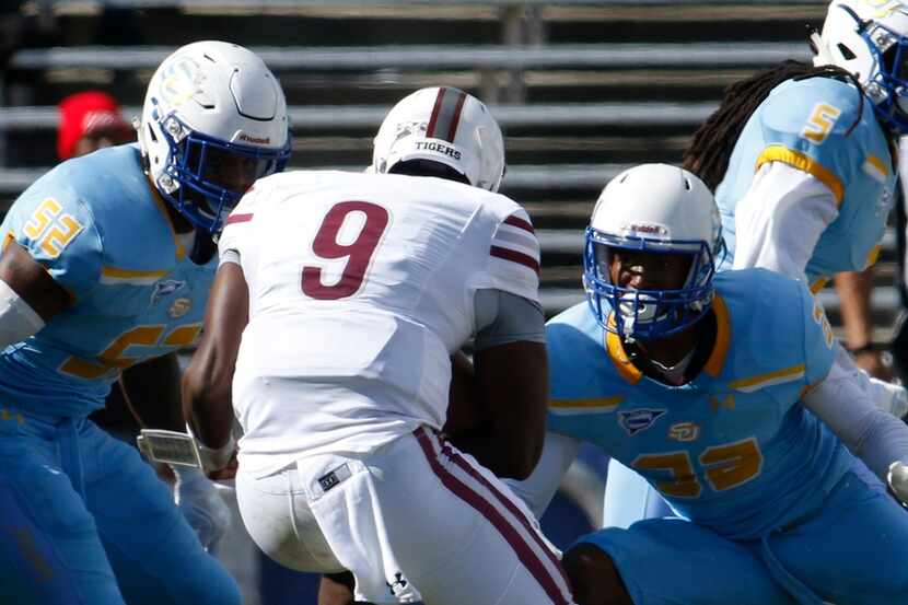 Texas Southern's Glen Cuiellett (9) is blanketed by Southern University linebackers during...
