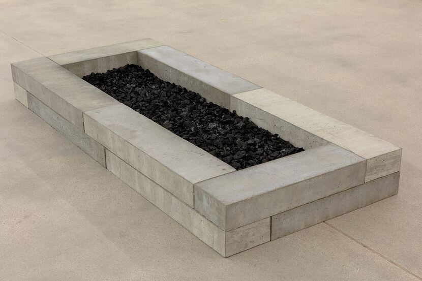 "Untitled (fire pit, charcoal, cement blocks)" features blocks perfectly assembled in a...