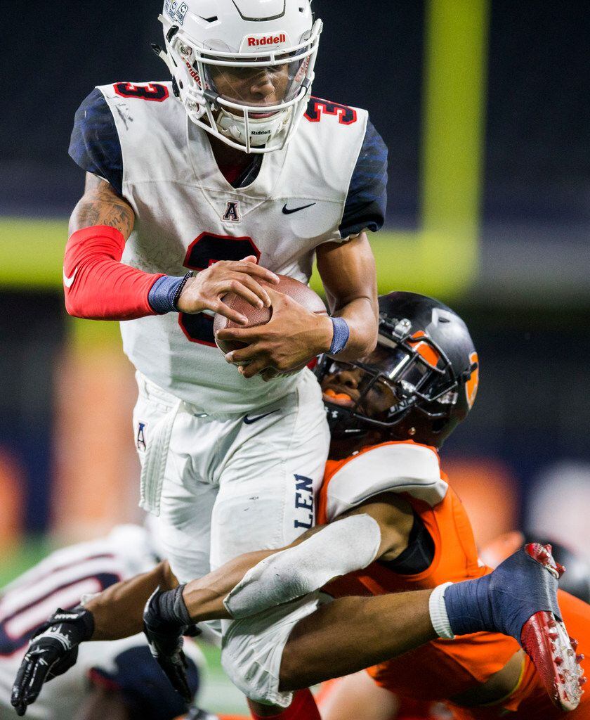 Allen quarterback Raylen Sharpe (3) is tackled by Rockwall defensive back Karson Hill (15) during the fourth quarter of a Class 6A Division I area-round high school football playoff game between Allen and Rockwall on Friday, November 22, 2019 at AT&T Stadium in Arlington. (Ashley Landis/The Dallas Morning News)