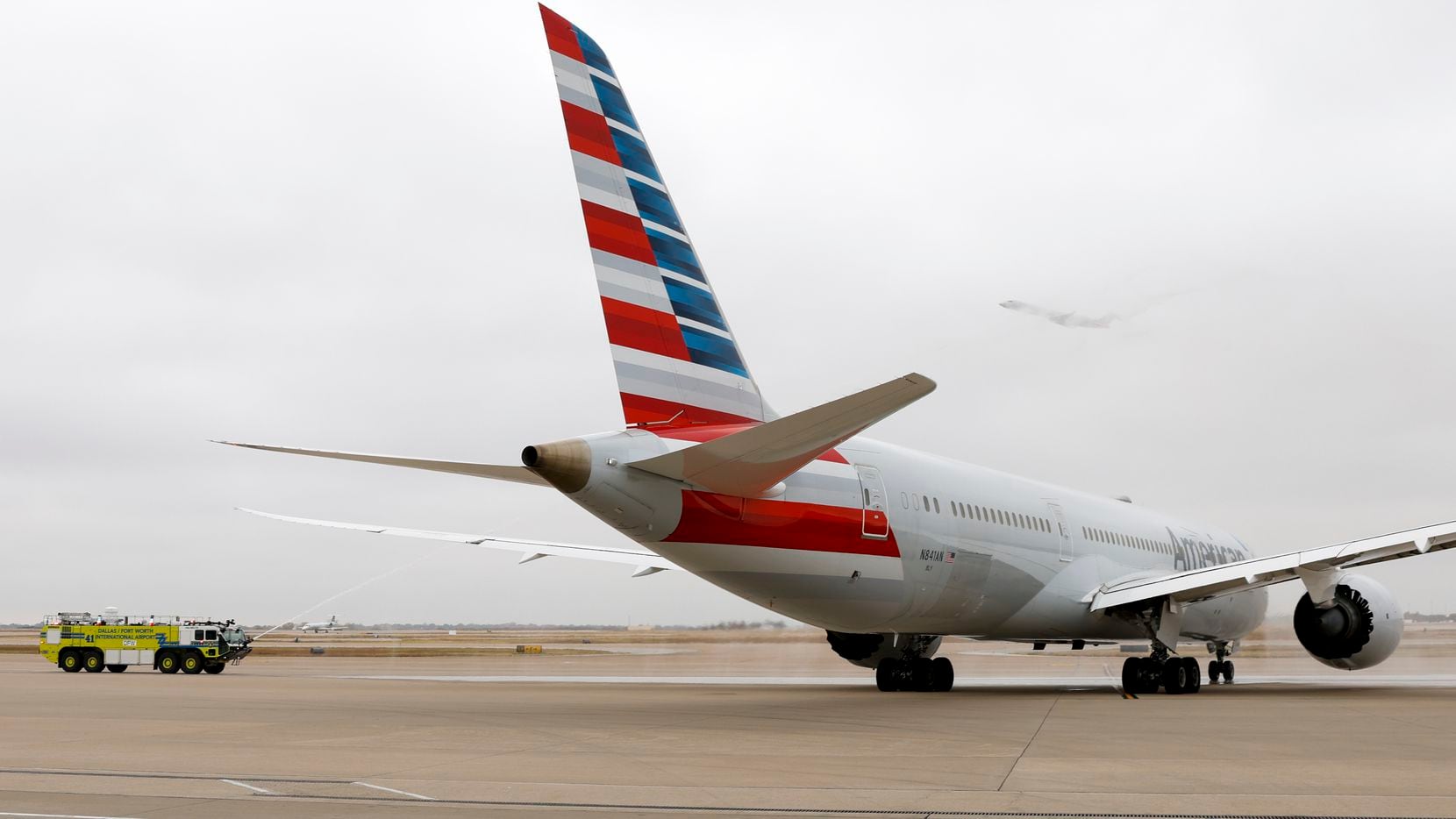 An American Airlines Boeing 787 Dreamliner carrying World War II veterans to Hawaii receives...