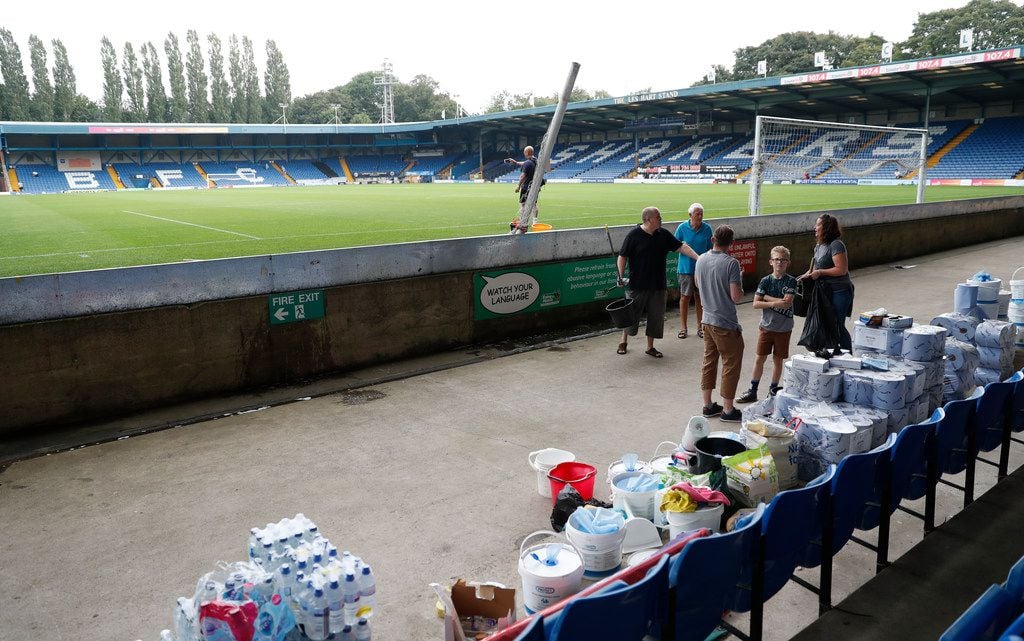 A general view of Gigg Lane stadium home of Bury Football Club, as volunteers help clean up...