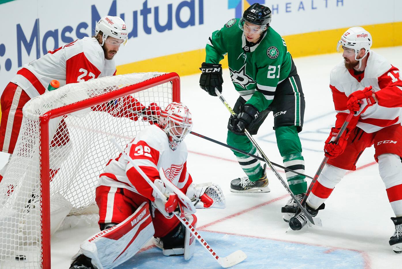 Dallas Stars forward Jason Robertson (21) shoots the puck past Detroit Red Wings goaltender Alex Nedeljkovic (39) for a goal during the third period of an NHL hockey game, Tuesday, November 16, 2021. Dallas won 5-2. (Brandon Wade/Special Contributor)