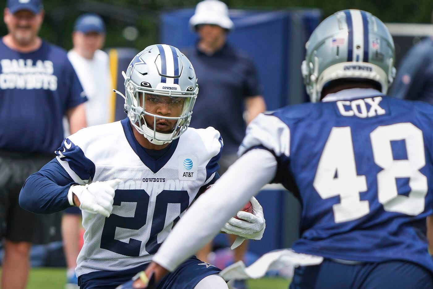 Dallas Cowboys running back Tony Pollard (20) works against linebacker Jabril Cox (48) during a minicamp practice at The Star on Tuesday, June 8, 2021, in Frisco. (Smiley N. Pool/The Dallas Morning News)