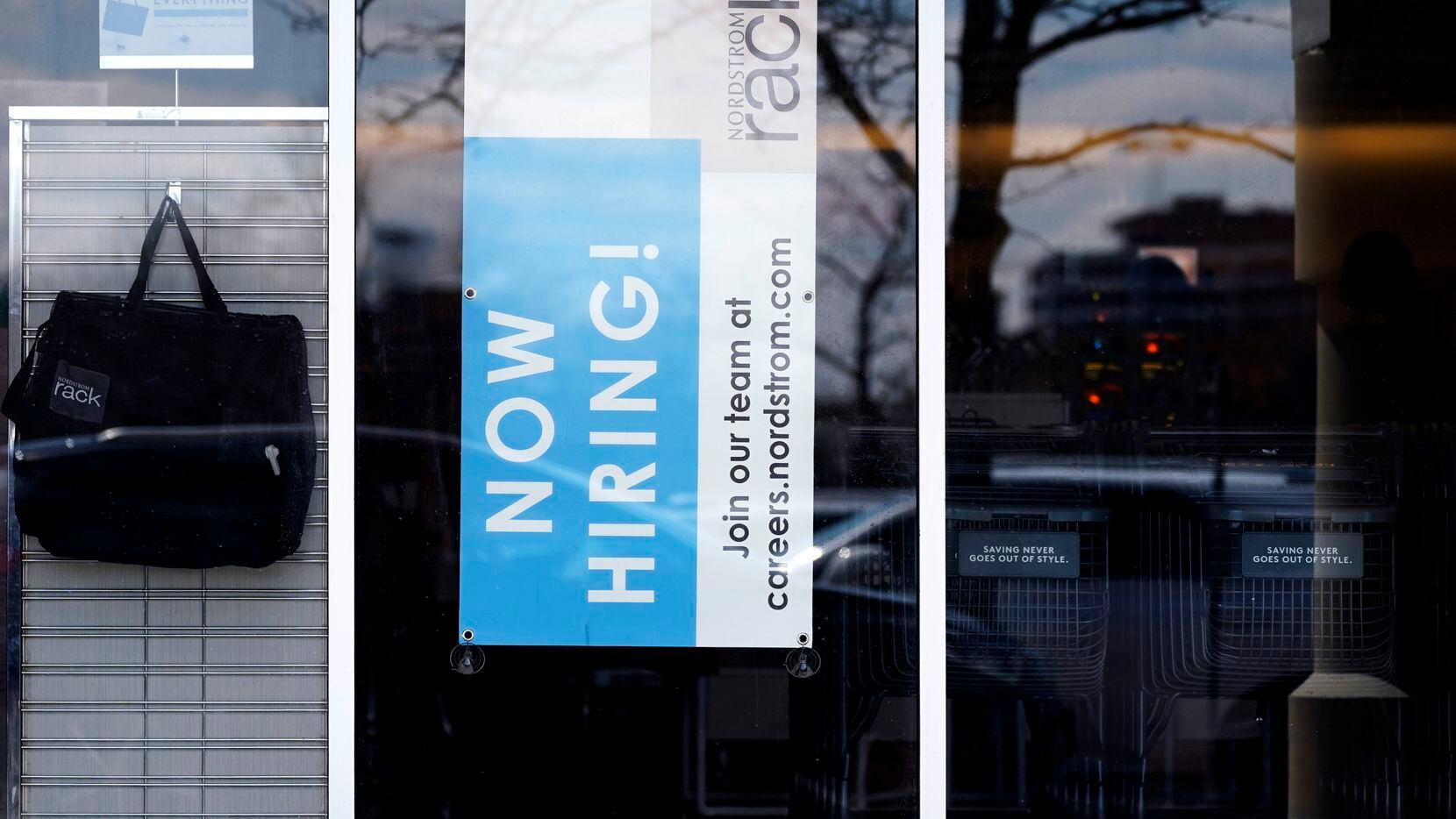 FILE - A hiring sign is seen at a retail store in Schaumburg, Ill., Friday, April 1, 2022.  ...