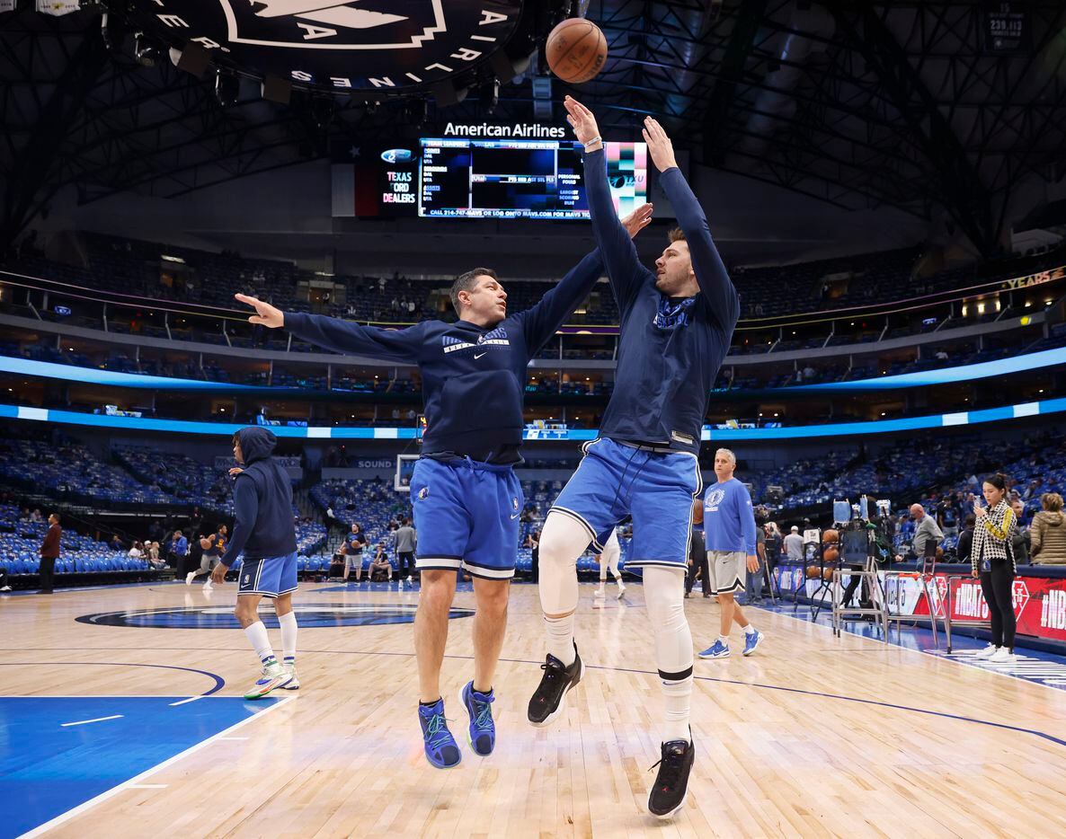 Dallas Mavericks guard Luka Doncic warms up with shooting coach Peter Patton before Game 5...