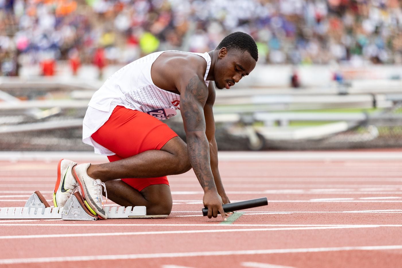 Chris Hicks of Duncanville prepares to race in the boys’ 4x200-meter relay at the UIL Track...