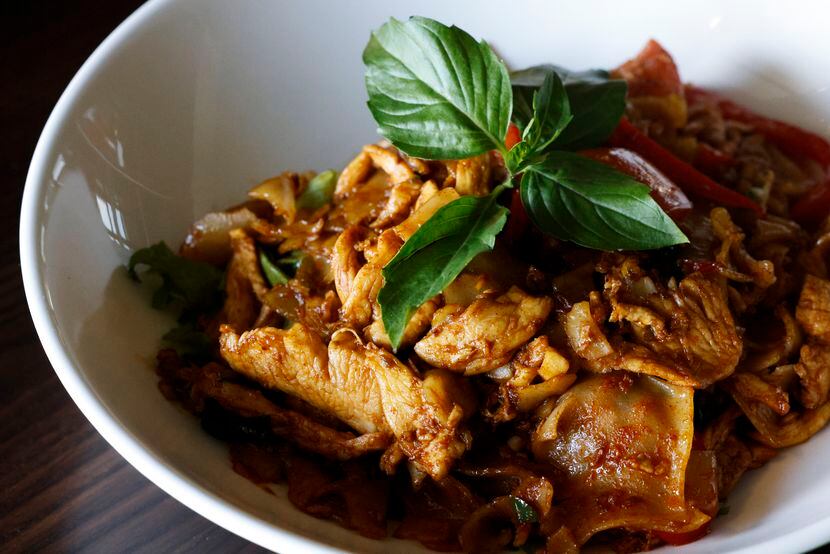 Pad krapow, a chicken and shrimp basil stir fry, is one of Asian Mint owner Nikky...