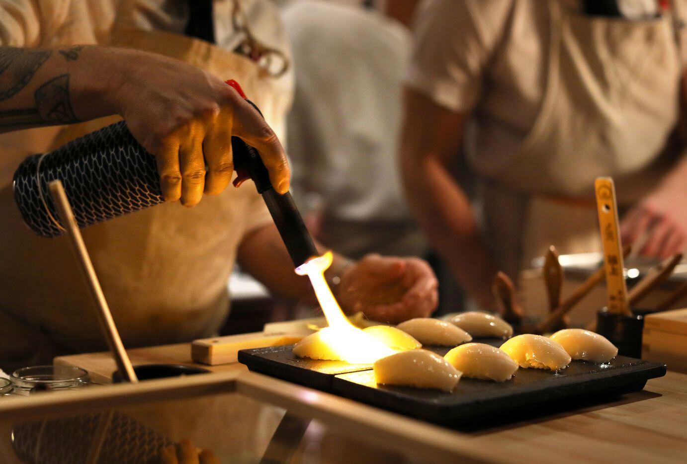 Phillip Frankland Lee prepares some Nigiri at Sushi By Scratch, a secret pop-up restaurant...