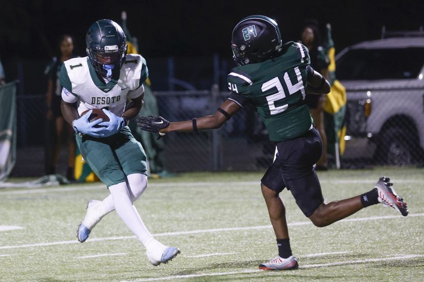 DeSoto's Johntay Cook II grabs one of his five touchdown catches in an 86-26 rout of...