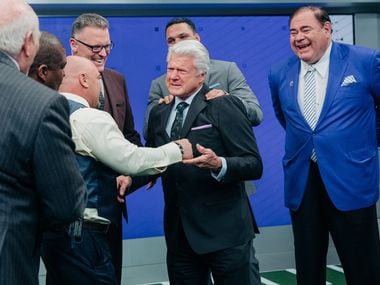 Jimmy Johnson's Fox Sports colleagues congratulate him after Johnson received the news that he'd been elected to the Pro Football Hall of Fame by the Hall's president, David Baker (at right, in blue jacket).
