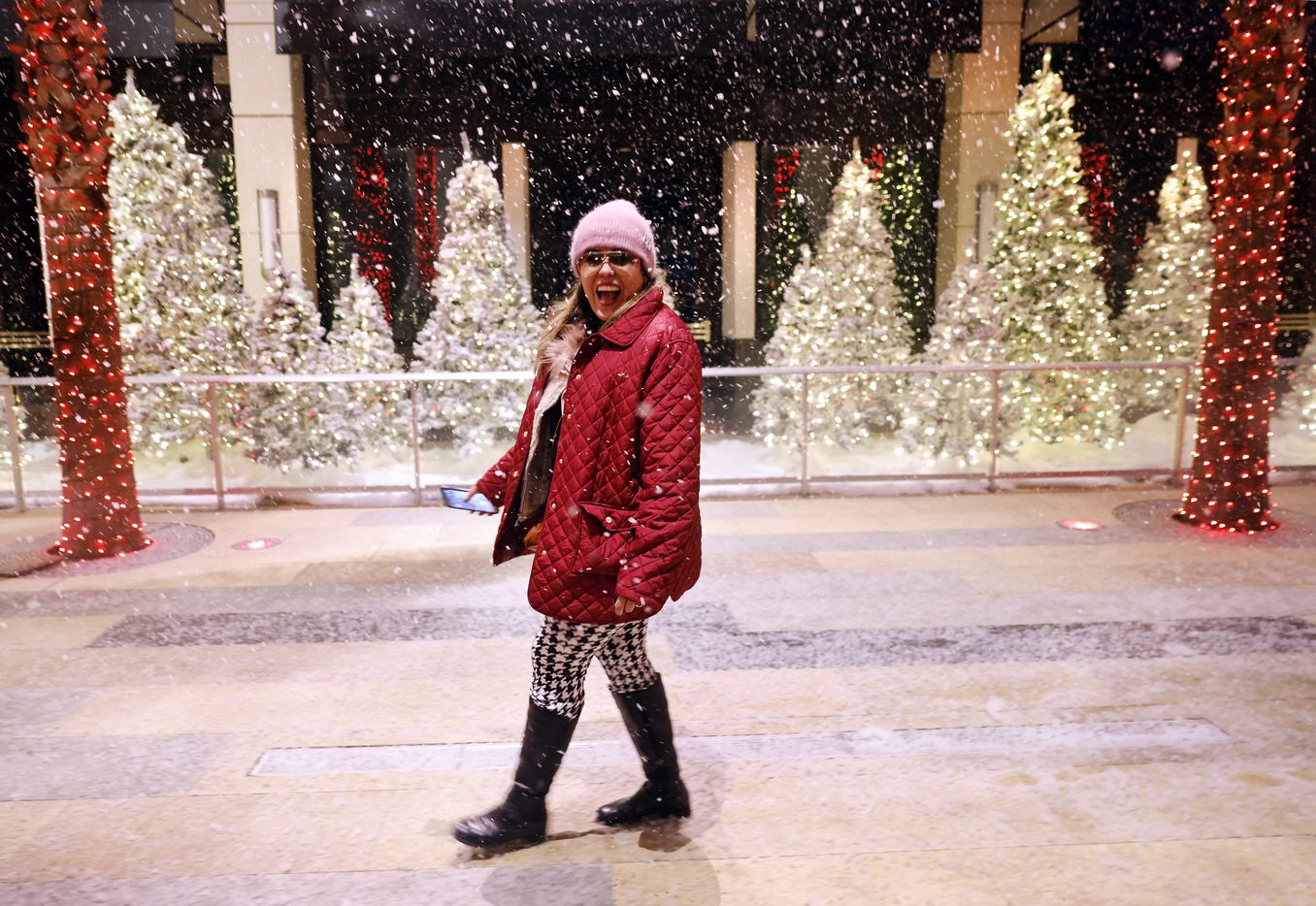 Sylvia Diaz of El Paso was excited about the artificial snow falling as she entered Galleria...