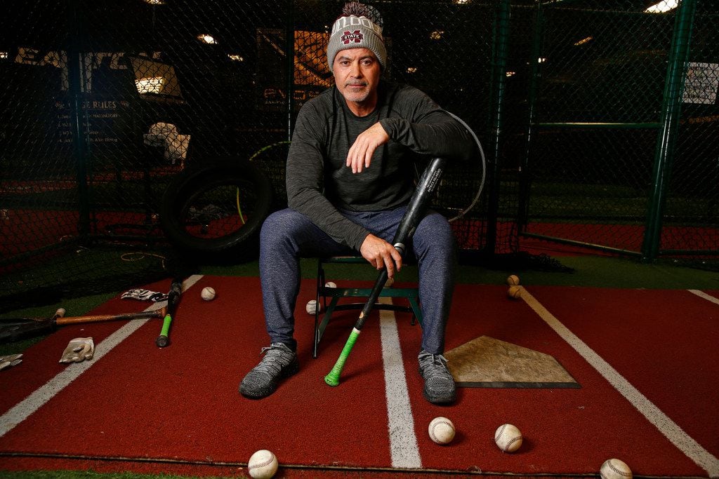 Former Texas Ranger Rafael Palmeiro poses for a portrait at D-BAT DFW batting cage in...