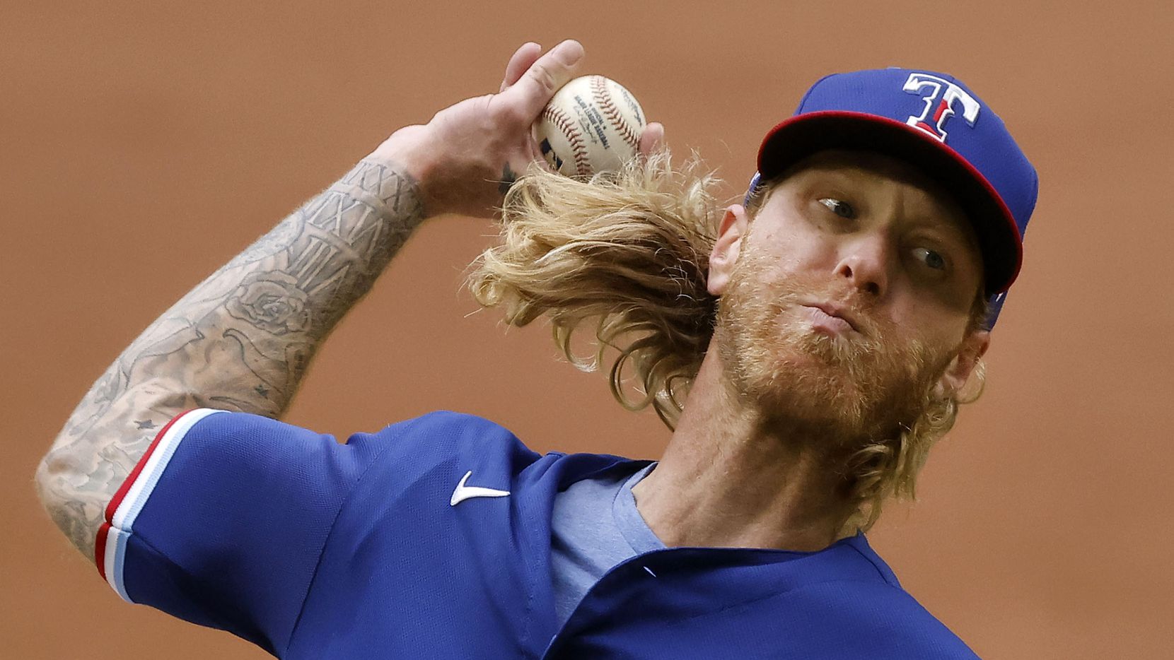 Texas Rangers starting pitcher Mike Foltynewicz (20) throws against the Milwaukee Brewers in the third inning at Globe Life Field in Arlington, Texas. The teams were playing in an exhibition game, Tuesday, March 30, 2021.
