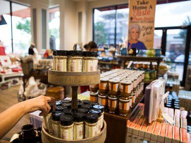 A woman reaches for a spice blend at a new location of Paula Deen's Family Kitchen...