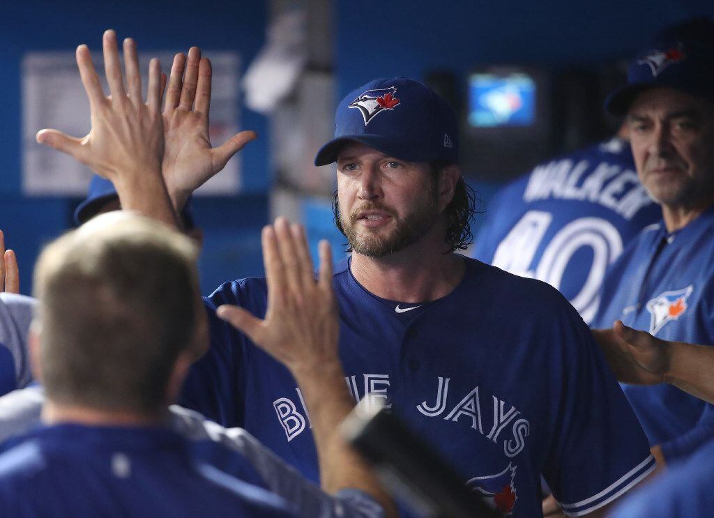 TORONTO, ON - JUNE 13: Jason Grilli #37 of the Toronto Blue Jays is congratulated by...