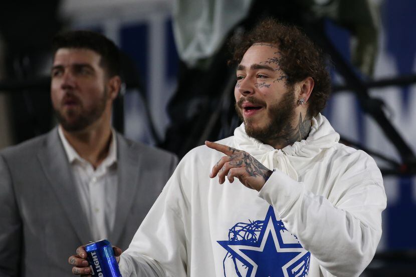In this Jan. 12, 2019 file photo, Post Malone watches the Dallas Cowboys and Los Angeles...