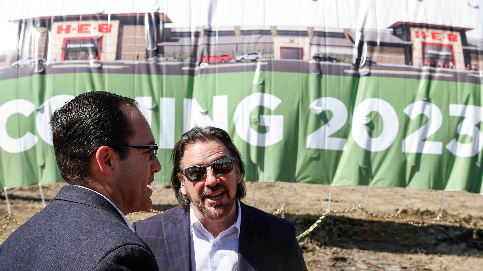 Juan-Carlos Ruck, (left), H-E-B executive vice president of Northwest food and drug, and...