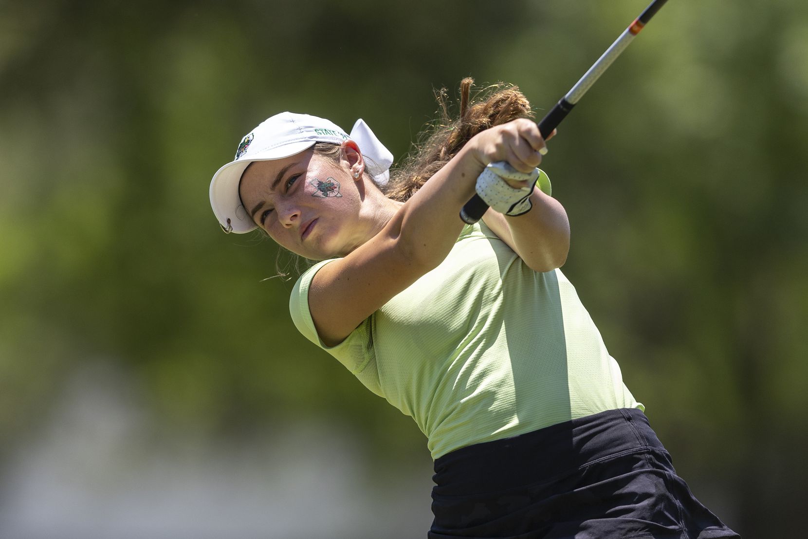 Southlake Carroll’s Makayla Tyrrell hits from the 18th tee box during the 6A girls state...