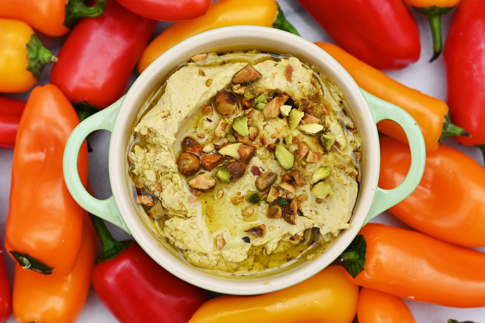 Pistachio Hummus served with baby peppers