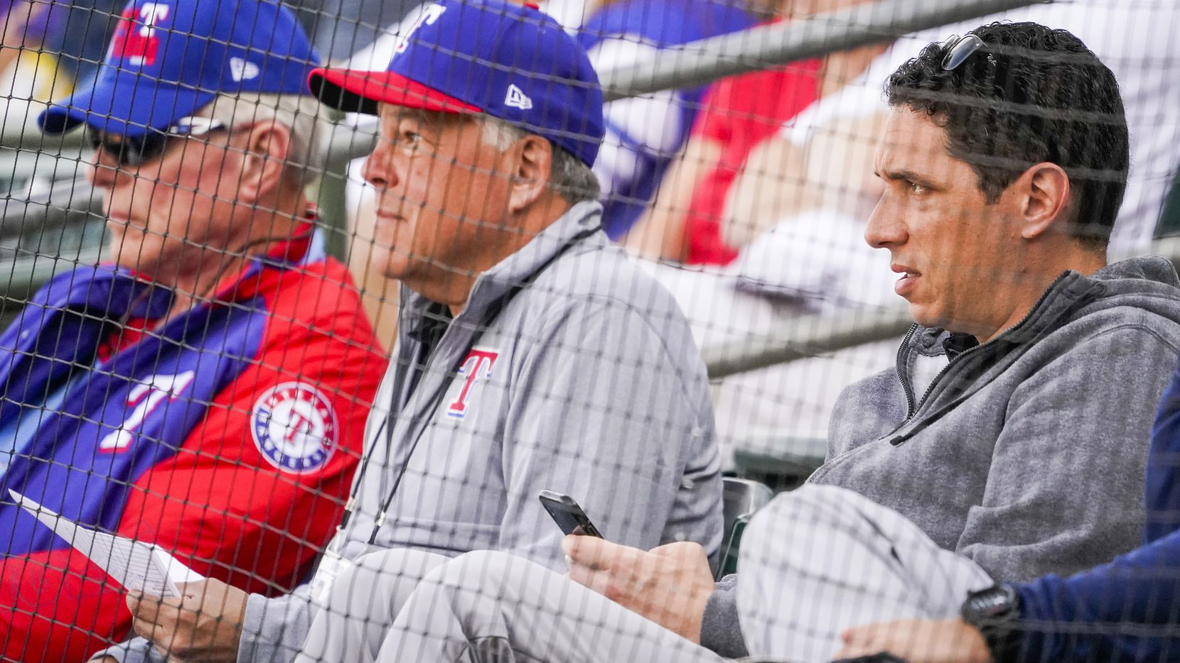 Texas Rangers general manager Jon Daniels (right) watches with co-chairman and managing...