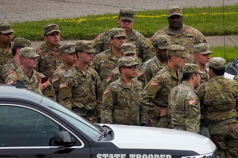 National Guard troops gathered near a protest outside the Frank Crowley Courts Building in...