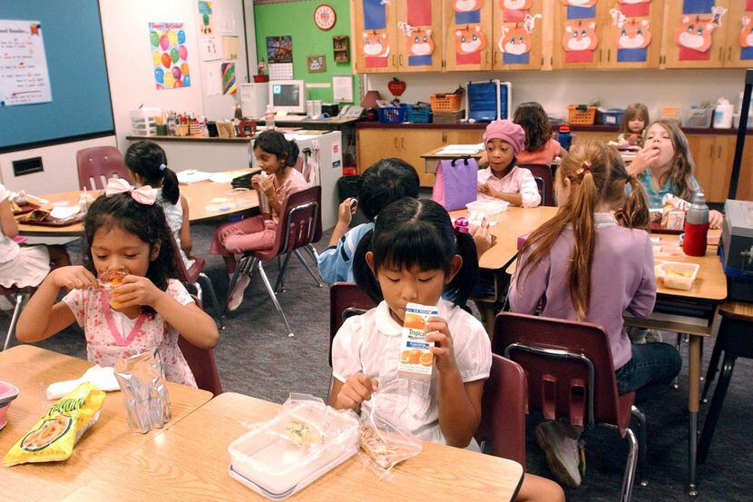 In this file photo, students eat lunch in a Plano ISD classroom.