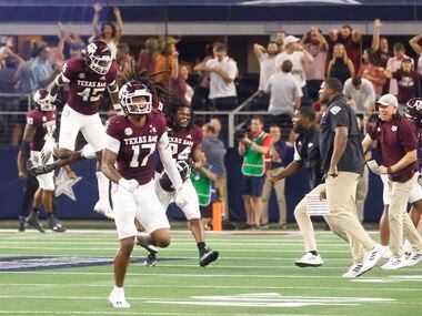 Texas A&M players celebrate as Arkansas misses to score from a field goal during the second...