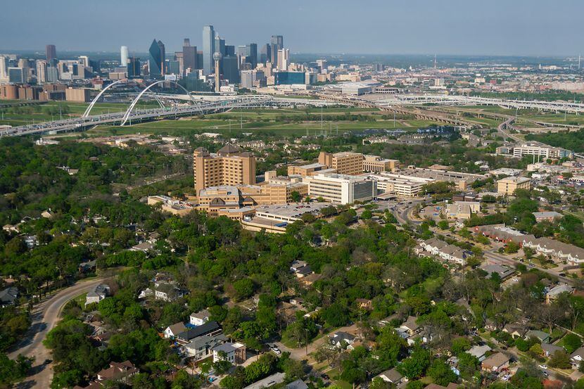 Aerial view of  Oak Cliff and Methodist Hospital  beneath the downtown skyline, Trinity...