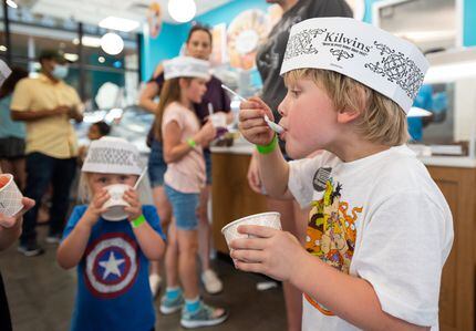 Hendrix Moody, 5, takes a bite of ice cream from Kilwins at Grandscape in The Colony.