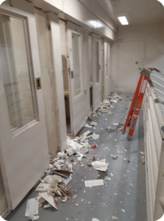 This photo shows trash that inmates had lodged into the metal housing covering the cell door...