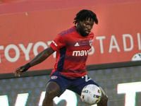 FC Dallas defender Ema Twumasi (22) pulls in a pass from a teammate during the first half of...
