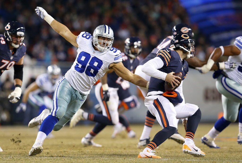 Dallas Cowboys defensive tackle Tyrone Crawford (98) chases down Chicago Bears quarterback...