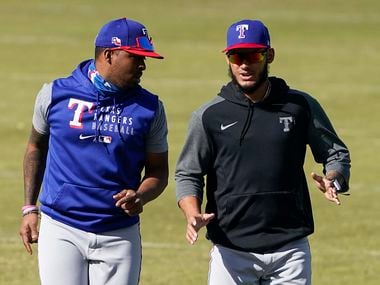 Rangers pitchers Jonathan Hernández (right) and Alex Speas are pictured during a workout at the team’s spring training facility on Saturday, March 6, 2021, in Surprise, Ariz.