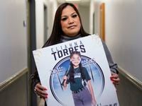 Sandra Torres, holds a photo of her daughter Eliahna, who was one of 19 students and two...