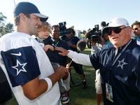Tony Romo, holding his son Hawkins, is greeted by Larry Lacewell, after the afternoon...
