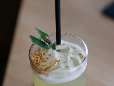 Cinners & Sage, made of Koval Gin, pineapple juice, cinnamon simple syrup and sage and is...