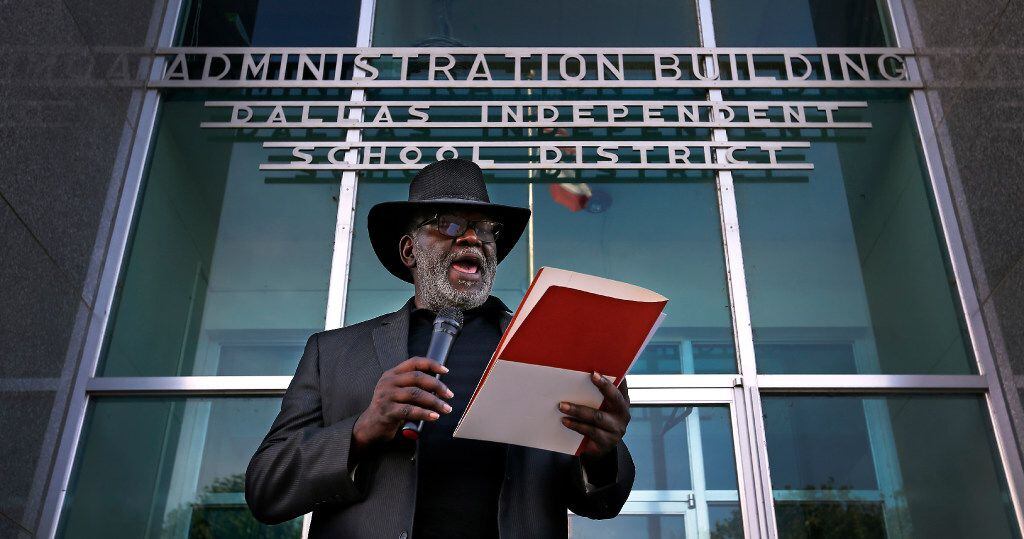 Rev. Gerald Britt, vice president of external affairs with CitySquare, reads a statement...
