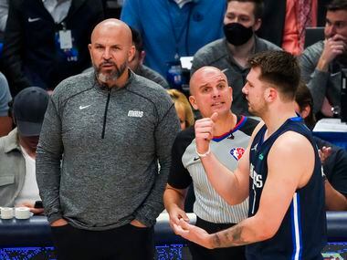Dallas Mavericks guard Luka Doncic argues for a call as coach Jason Kidd looks on during the...