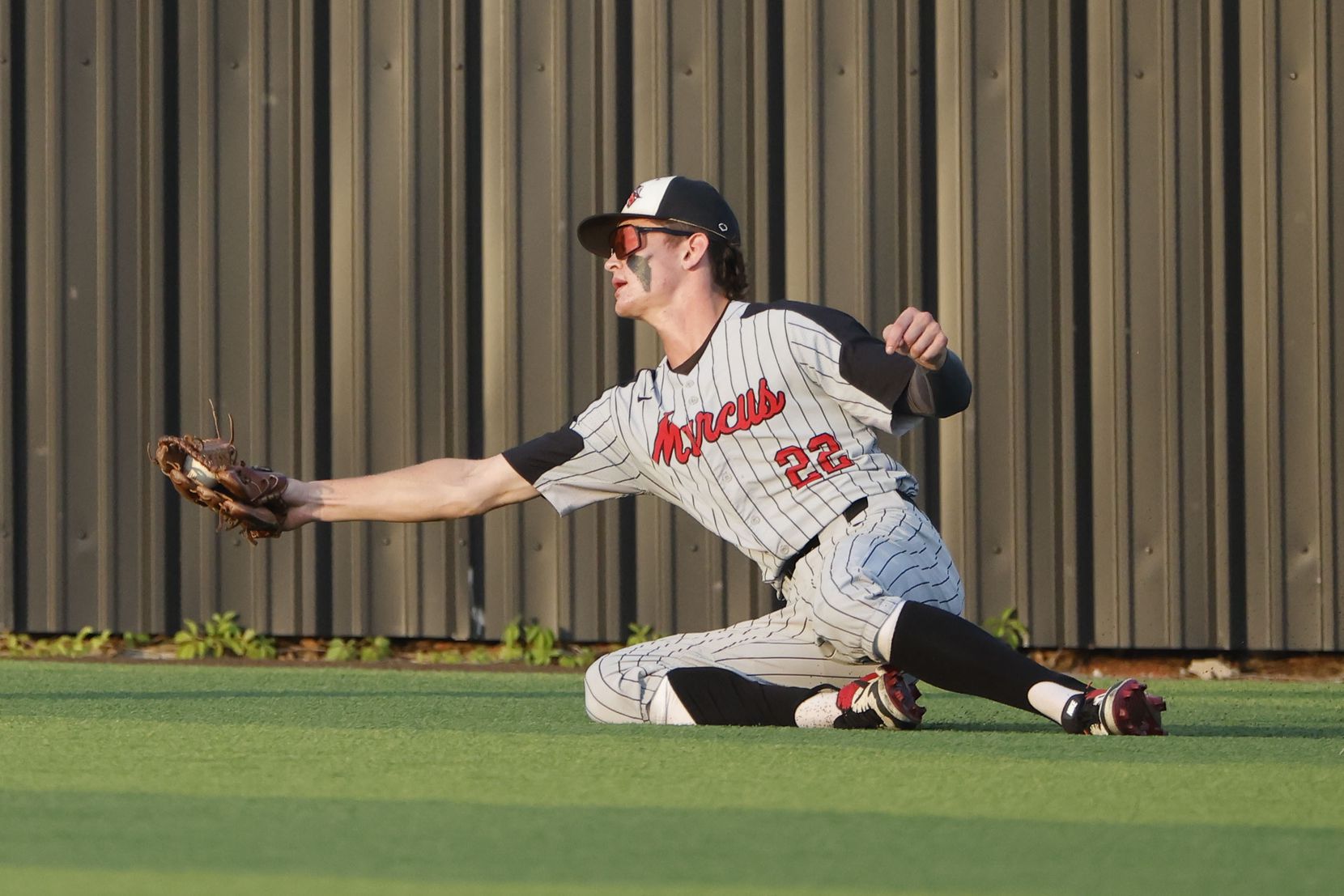 Flower Mound Marcus player Caden Sorrell makes a catch against Keller during the first...