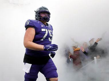 TCU Horned Frogs center Brannon Brown (75) takes the field in fog as the team faces Iowa...